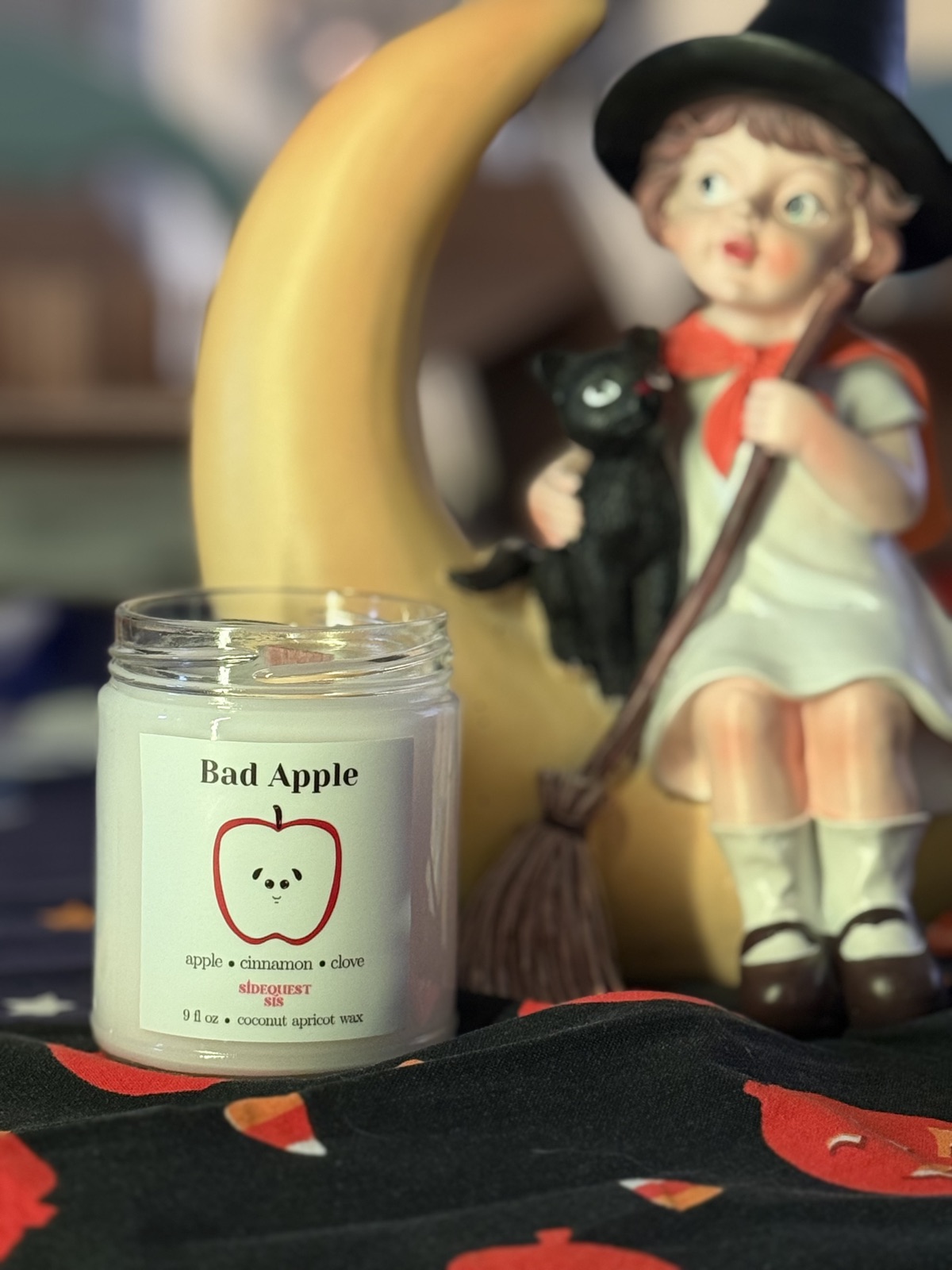 Bad Apple candle in a 9 fl oz glass jar, styled fall photo