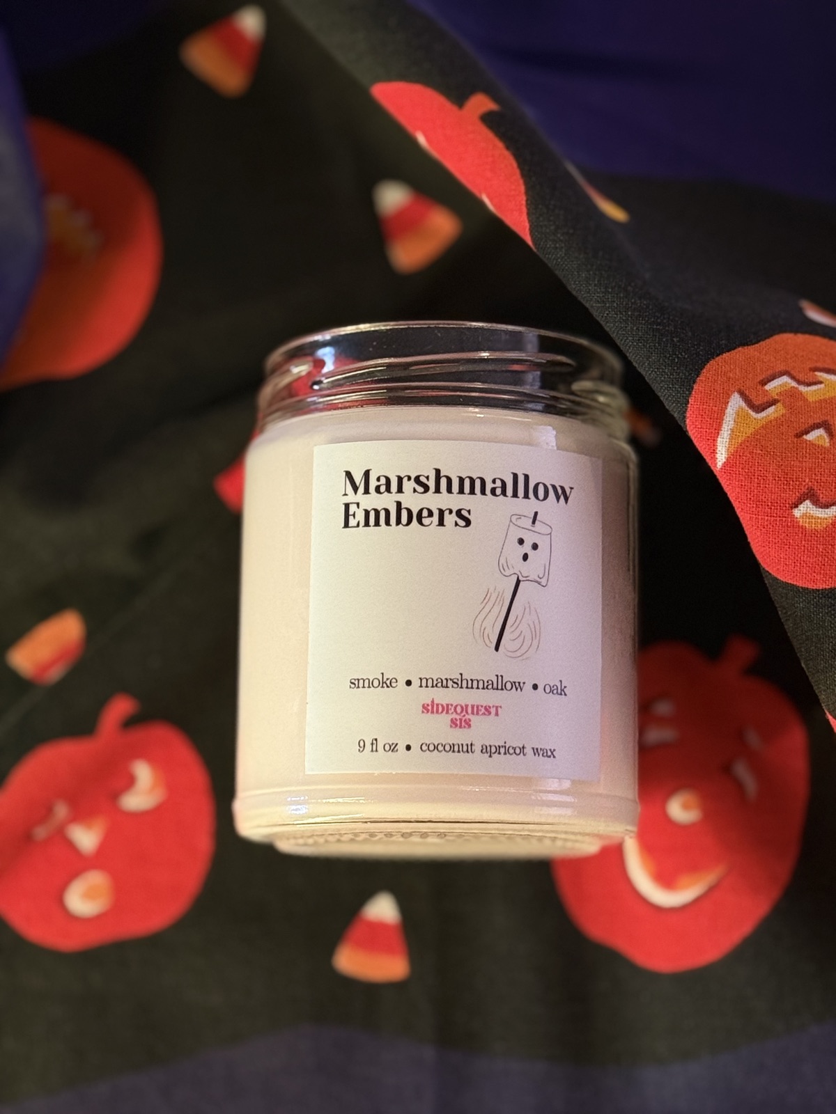 Marshmallow Embers candle in a 9 fl oz glass jar, styled fall photo